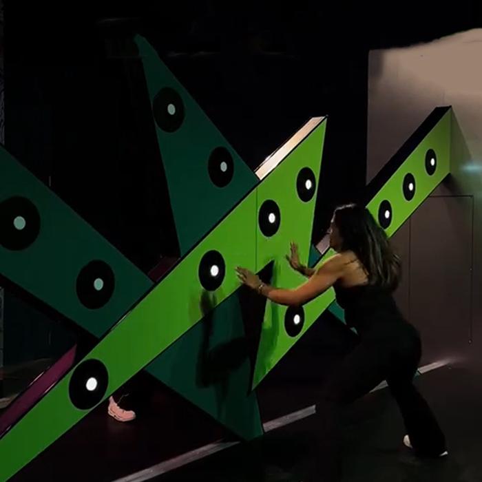 Illuminated targets on a commercial reaction wall